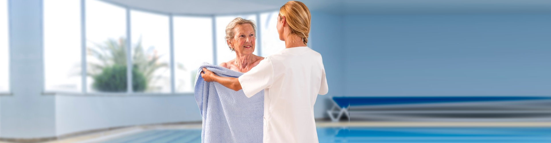 caregiver giving a towel to senior