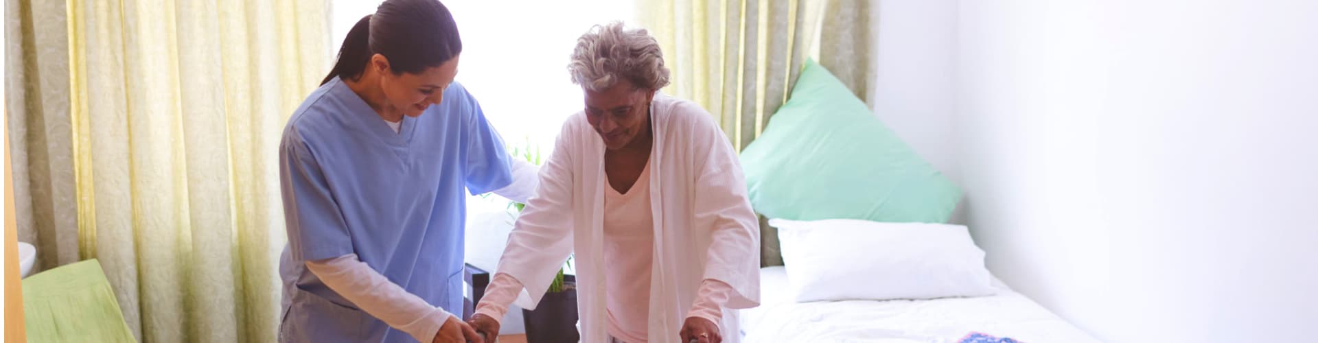 woman helping senior move around